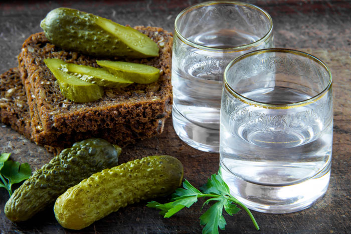 glasses of vodka with pickles